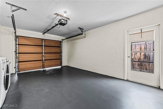 garage featuring a garage door opener and washer and clothes dryer