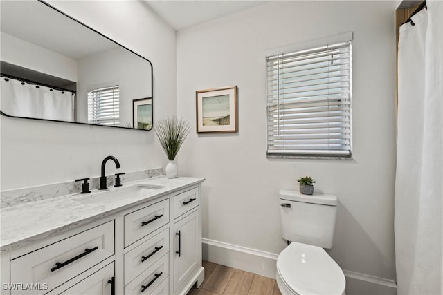 bathroom with vanity and toilet