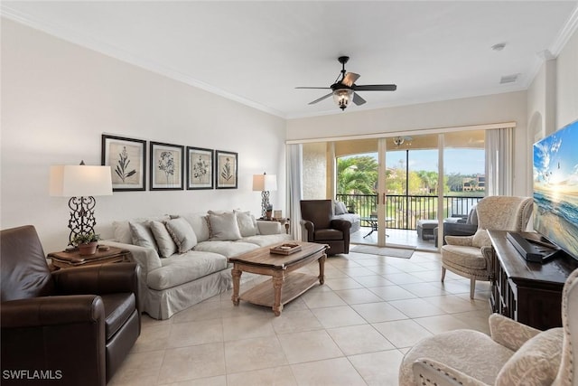 living room with ceiling fan, light tile patterned floors, and crown molding