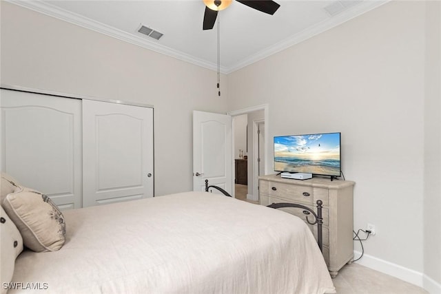 bedroom with a closet, ceiling fan, and crown molding