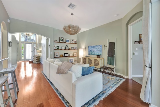 living room with wood-type flooring and french doors