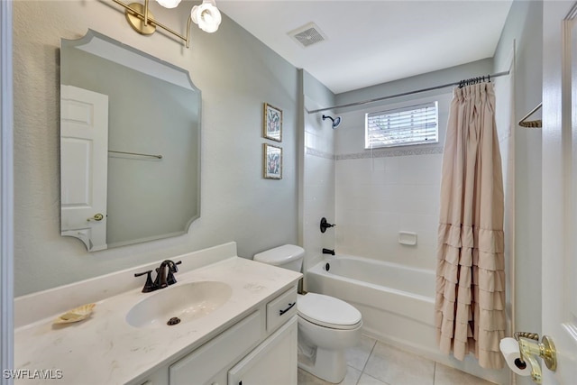 full bathroom with tile patterned floors, shower / bath combo, toilet, and vanity