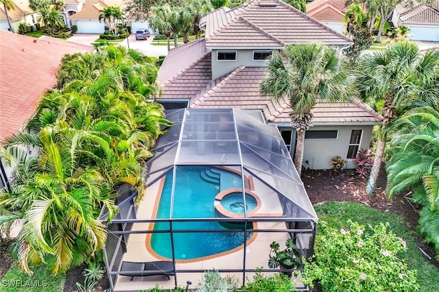 view of pool featuring an in ground hot tub and a patio