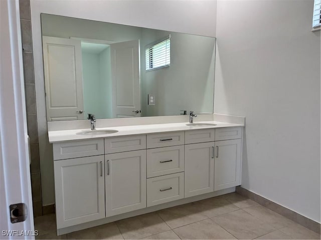 bathroom featuring tile patterned flooring and vanity