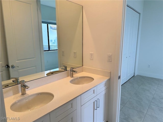 bathroom featuring tile patterned flooring and vanity