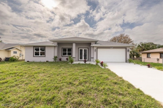 view of front facade featuring french doors, a front lawn, and a garage