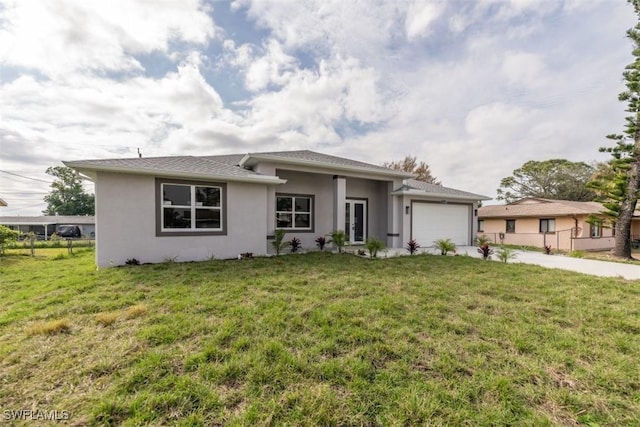 view of front facade with a garage and a front yard