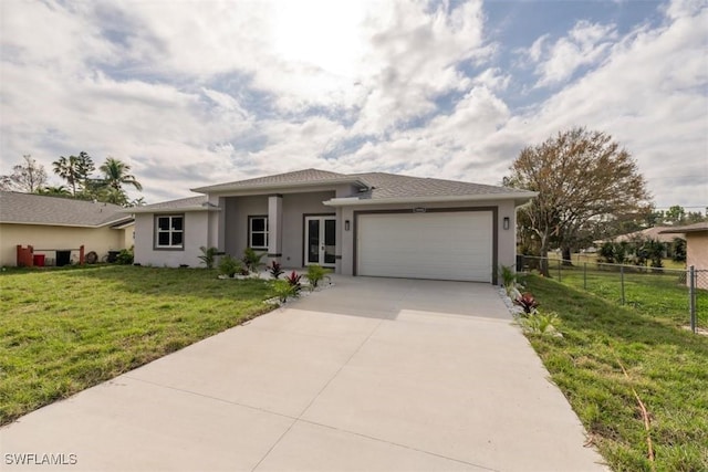 view of front of home featuring a front lawn and a garage