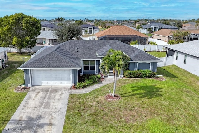 single story home featuring a garage and a front yard