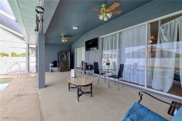 view of patio with a lanai and ceiling fan