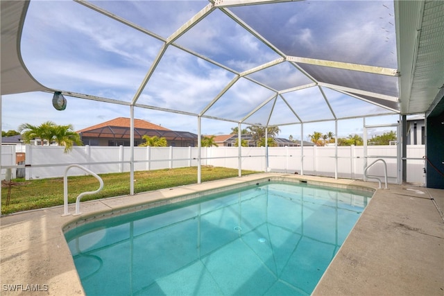 view of pool featuring a patio area and glass enclosure