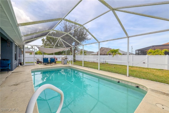 view of pool featuring a patio area, a lanai, and a yard