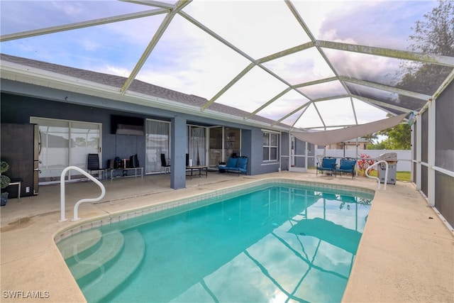 view of pool featuring a patio area and a lanai