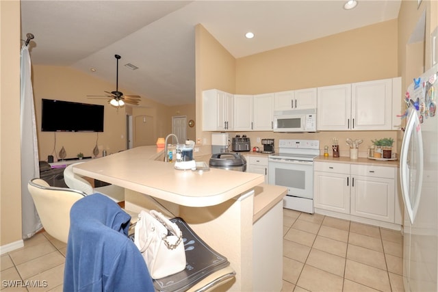 kitchen with ceiling fan, kitchen peninsula, white appliances, white cabinetry, and light tile patterned floors