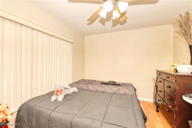 bedroom featuring ceiling fan and light wood-type flooring