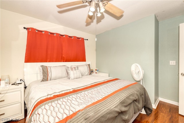 bedroom featuring ceiling fan and dark hardwood / wood-style floors