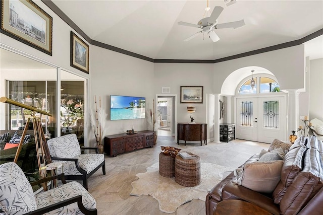 living room with ceiling fan, french doors, high vaulted ceiling, and ornamental molding