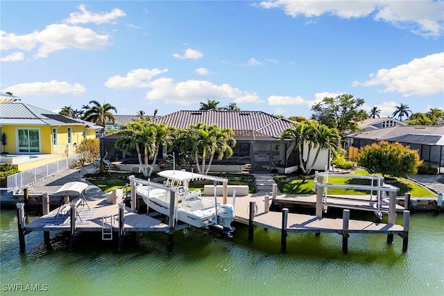 view of dock with a lanai and a water view