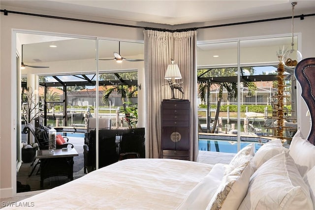 bedroom featuring access to outside and a water view