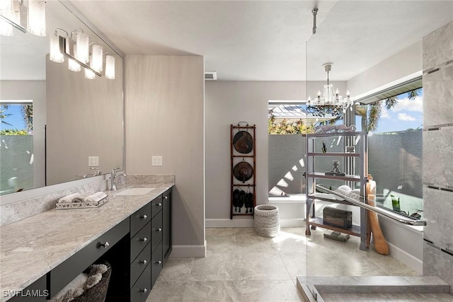 bathroom featuring vanity and a chandelier