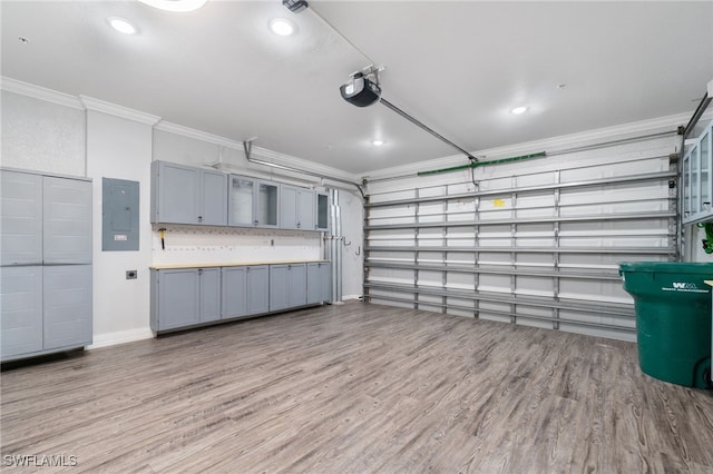 garage featuring a garage door opener and electric panel