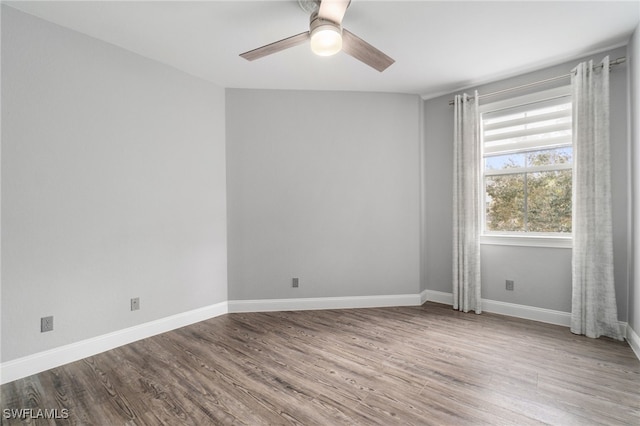 spare room featuring ceiling fan and light hardwood / wood-style flooring