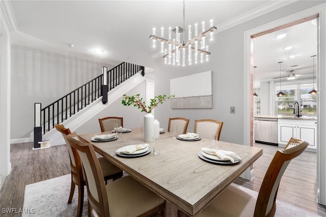 1330 Mariposa Cir Unit 103, Naples, FL 34105 - dining area with crown molding, stairs, ceiling fan with notable chandelier, light wood finished floors, and recessed lighting