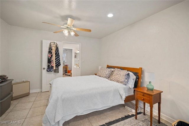 tiled bedroom featuring ceiling fan