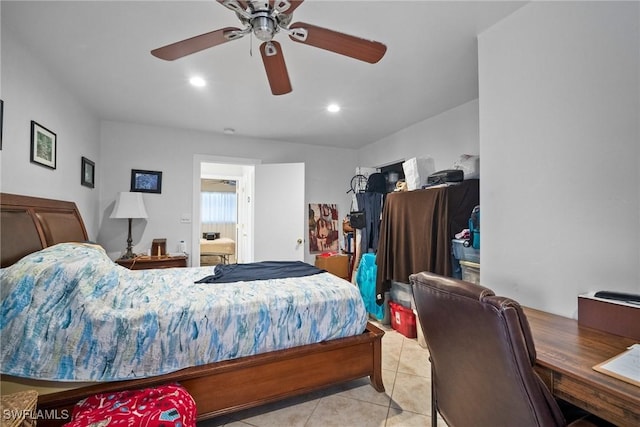 tiled bedroom with ceiling fan