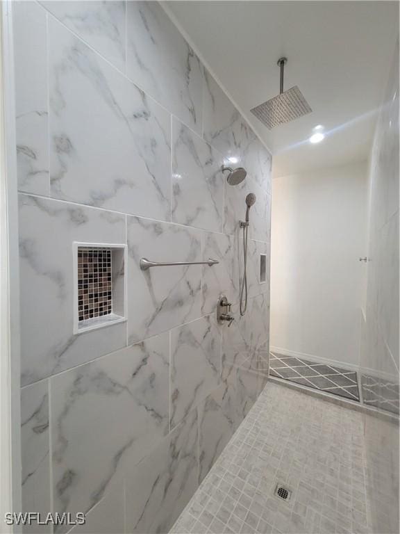 bathroom with a tile shower