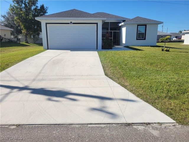 view of front of home with a garage and a front lawn