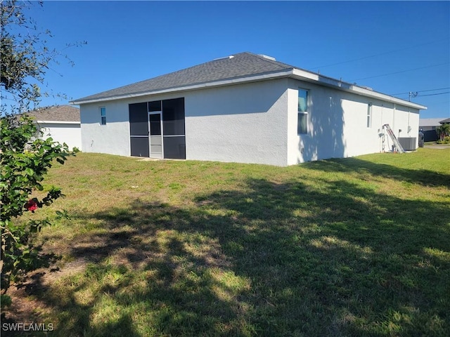 rear view of property with a lawn