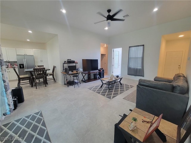 tiled living room with ceiling fan