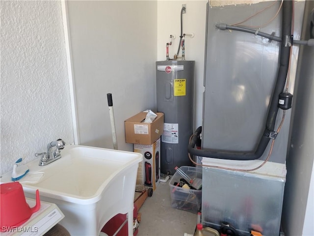 utilities with heating unit, water heater, and sink