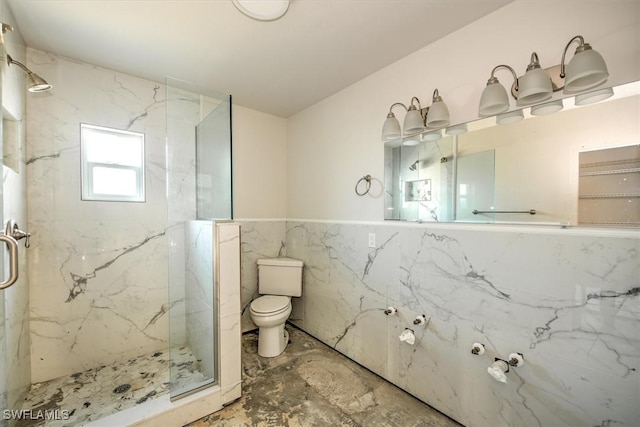 bathroom with toilet, a shower with door, and tile walls