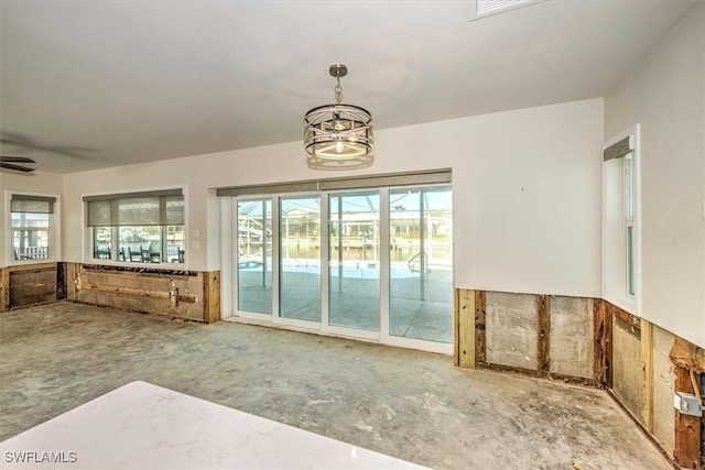 living room with concrete flooring and ceiling fan