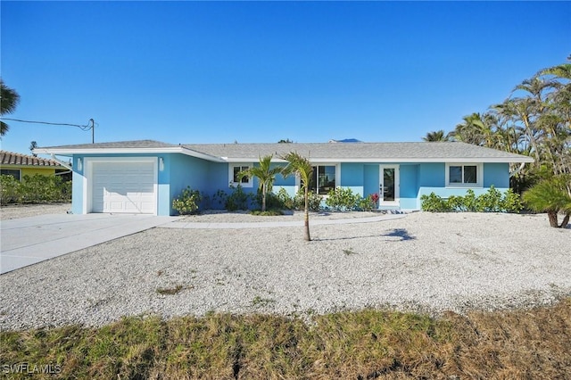 ranch-style home with a garage