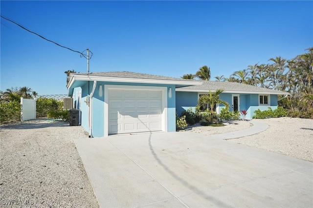 ranch-style home featuring a garage