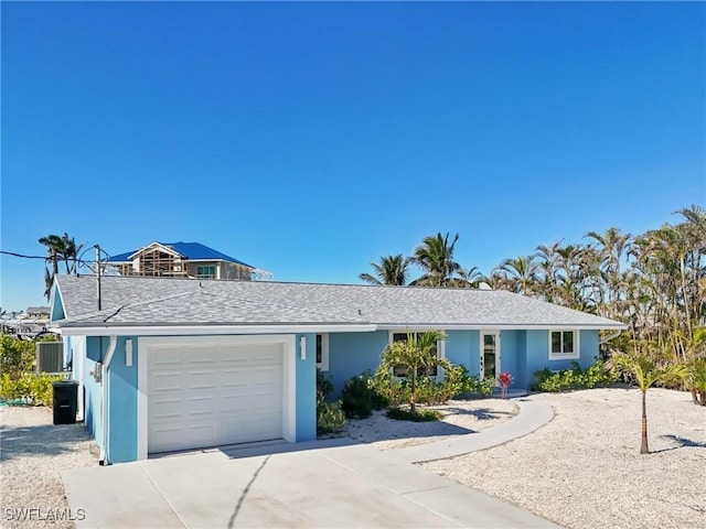 single story home featuring a garage