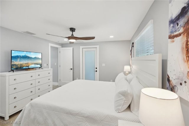 bedroom featuring ceiling fan and light hardwood / wood-style flooring