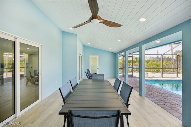 dining room with ceiling fan, wooden ceiling, vaulted ceiling, and light wood-type flooring