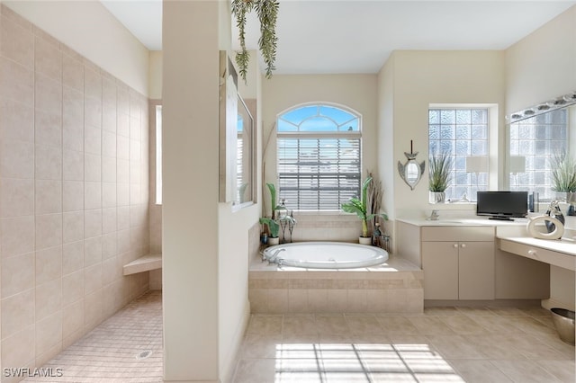 bathroom with tile patterned floors, plus walk in shower, and vanity