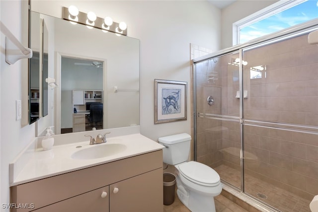 bathroom featuring walk in shower, vanity, and toilet