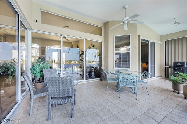 sunroom / solarium featuring vaulted ceiling and ceiling fan