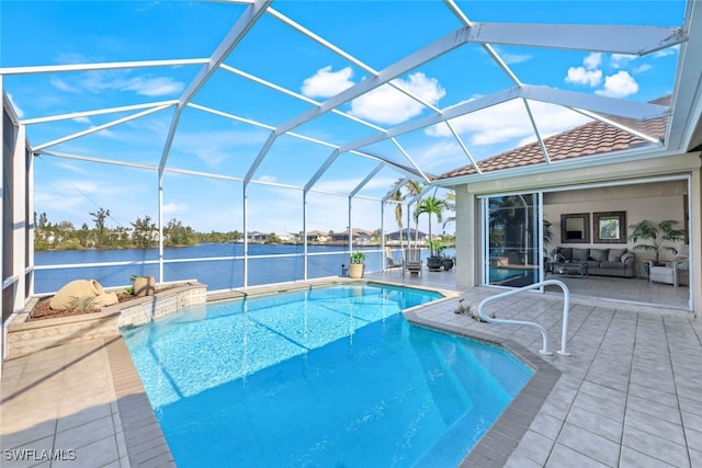 view of pool with a lanai, a patio area, and a water view