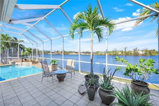 view of swimming pool with a water view, a lanai, and a patio area