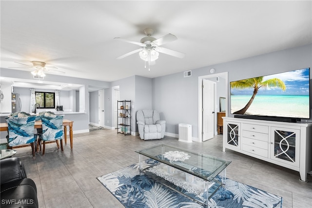 living room featuring ceiling fan