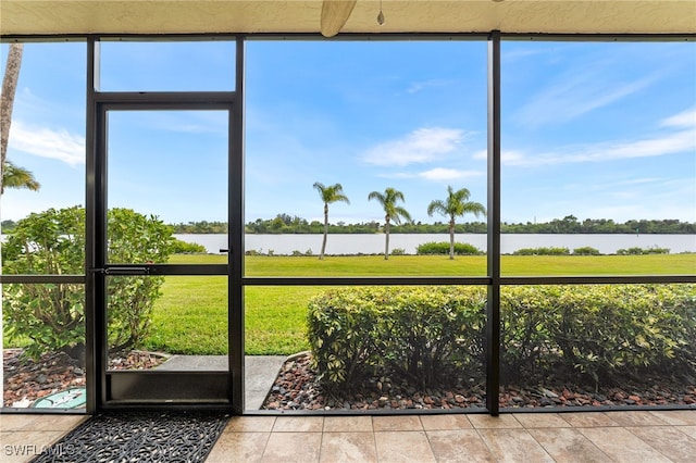 unfurnished sunroom with a water view