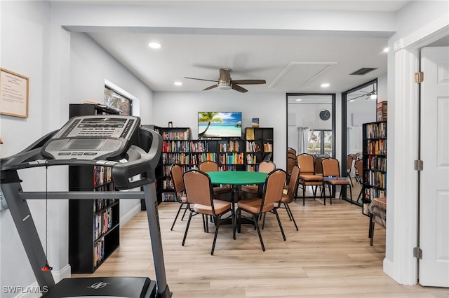 playroom with ceiling fan and light wood-type flooring