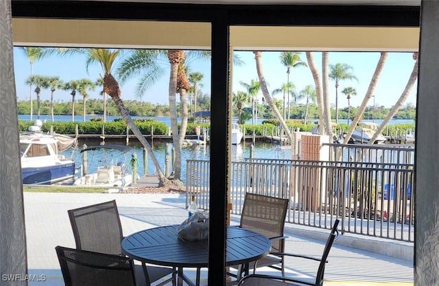 view of patio featuring a dock and a water view